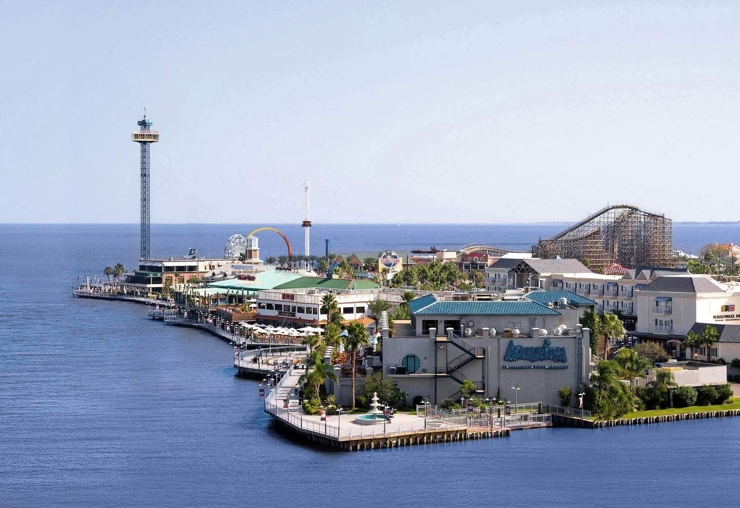 Kemah Boardwalk City Card (Kemah) A coastal amusement park with a wooden roller coaster, Ferris wheel, observation tower, and various buildings.