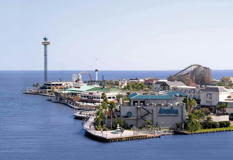 Kemah Boardwalk City Card (Kemah) A coastal amusement park with a wooden roller coaster, Ferris wheel, observation tower, and various buildings.