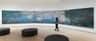 The Museum of Modern Art (MoMA) City Card (New York) A person views an expansive wall-mounted painting of water lilies in a minimalist gallery with dark gray seating.