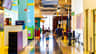 A colorful indoor play area with a parent and child walking hand in hand, surrounded by vibrant displays and signage.